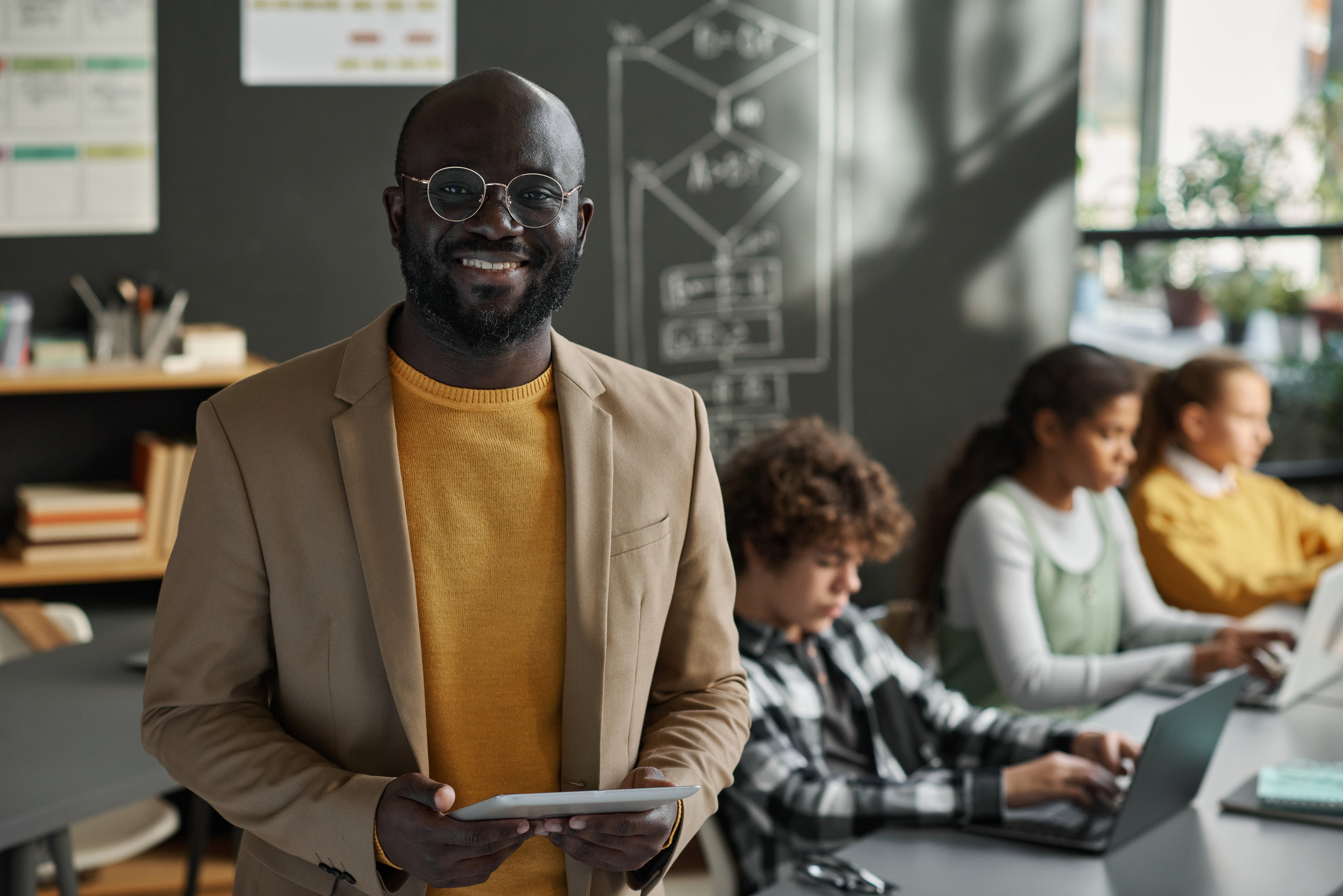 african-american-it-teacher-standing-in-classroom-2026-01-11-11-11-26-utc