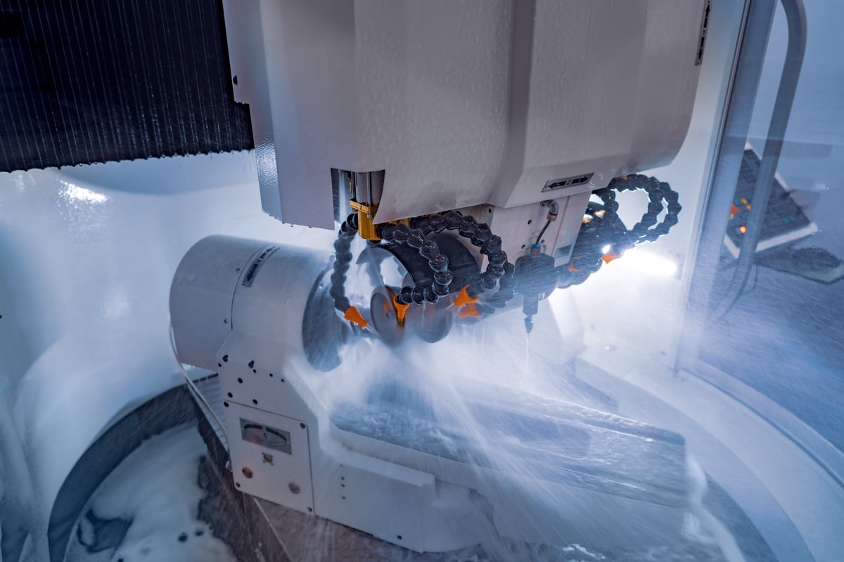 CNC milling machine cutting metal. Precision manufacturing with CAD-driven workflows.