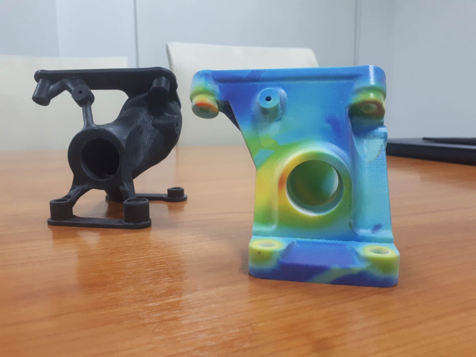 Design For Additive Manufacturing: FEA stress analysis printed on J750 and topology optimized part. 